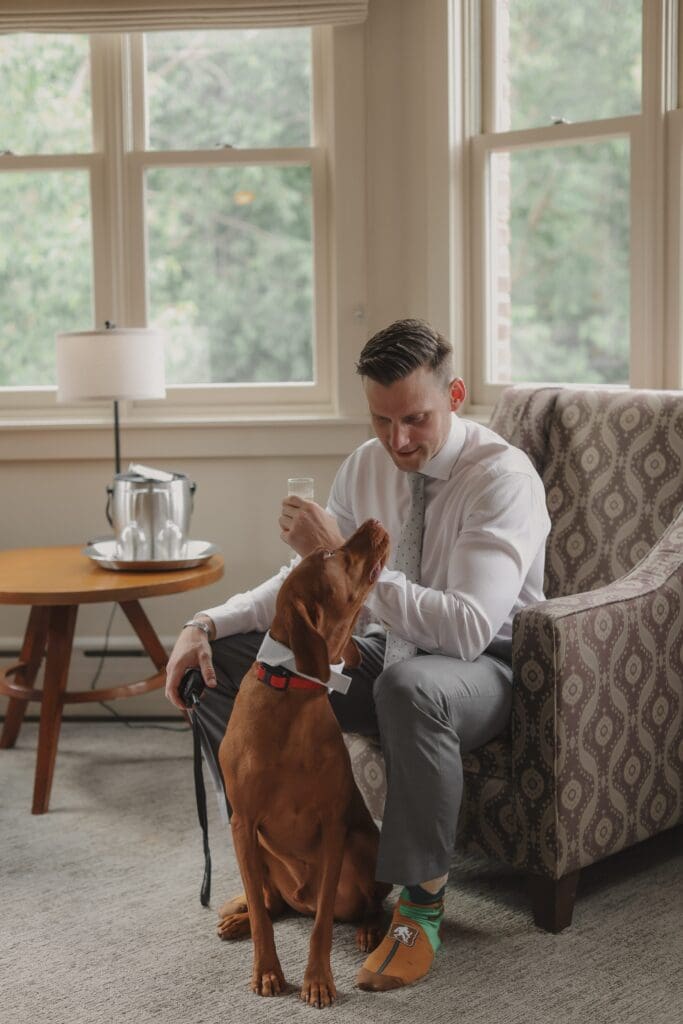 groom with his dog
