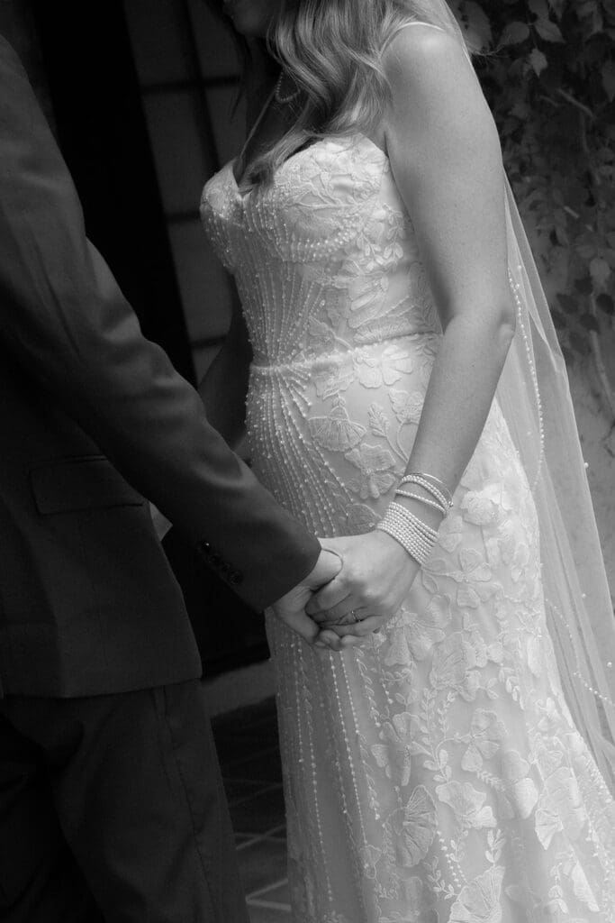 bride and groom holding hands vintage